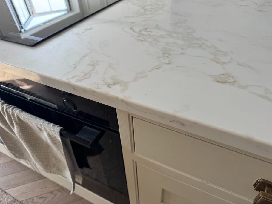After repair: restored quartz island edge This picture of the quartz island bar is showing the full repair being carried out.